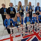 Members of the Dokan karate squad with their world championship trophy haul.