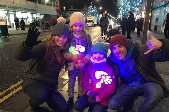 Rachel and Sam Hawdon with children Esther, five, and Maggie, eight, prepare to enjoy the Christmas parade in Ocean Road, South Shields.