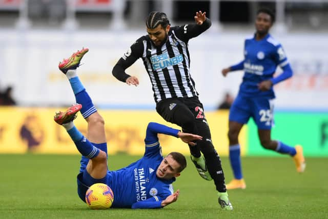 Leicester City's Belgian defender Timothy Castagne (L) vies with Newcastle United's US defender DeAndre Yedlin (C) during the English Premier League football match between Newcastle United and Leicester City at St James' Park in Newcastle-upon-Tyne, north east England on January 3, 2021.