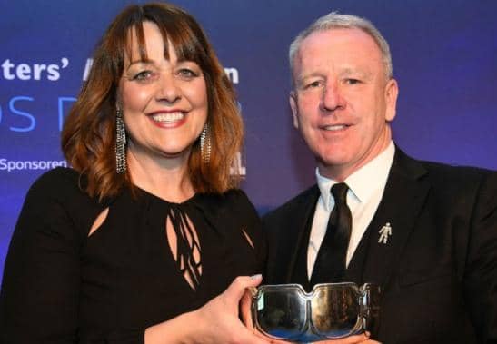 Louise Wanless being presented with the John Fotheringham Award by Kevin Ball in 2019 at a ceremony held at Ramside Hall.
