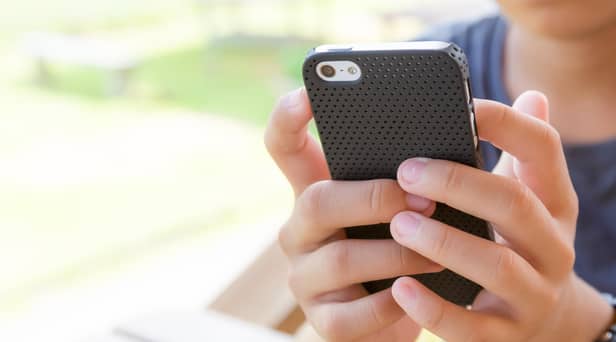 Starting secondary school age is the time most young people get their first mobile phone. Photo Abode Stock