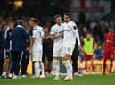 Leeds United's Pascal Struijk, right, is consoled by Liam Cooper after being shown a red card.