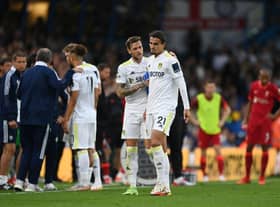 Leeds United's Pascal Struijk, right, is consoled by Liam Cooper after being shown a red card.