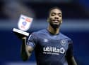 Ivan Toney holds up a man of the match award.