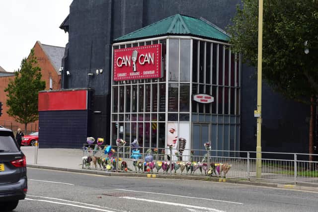 Dozens of flowers have been tied to the railings outside of the Can Can Bar in South Shields following the incident.