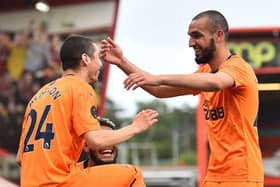 Miguel Almiron celebrates his goal against Bournemouth with Nabil Bentaleb.