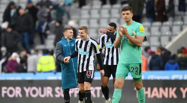 Kieran Trippier, Matt Targett and Jamaal Lascelles of Newcastle United share a joke after the friendly match between Newcastle United and Rayo Vallecano at St James' Park on December 17, 2022 in Newcastle upon Tyne, England. (Photo by Stu Forster/Getty Images)
