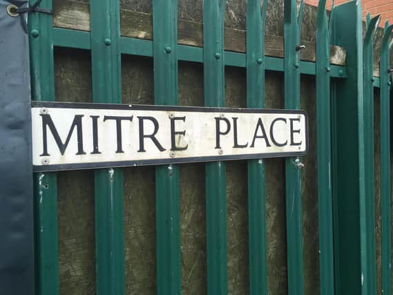 Witnesses said they saw a large police presence in Mitre Place as inquiries were carried out.