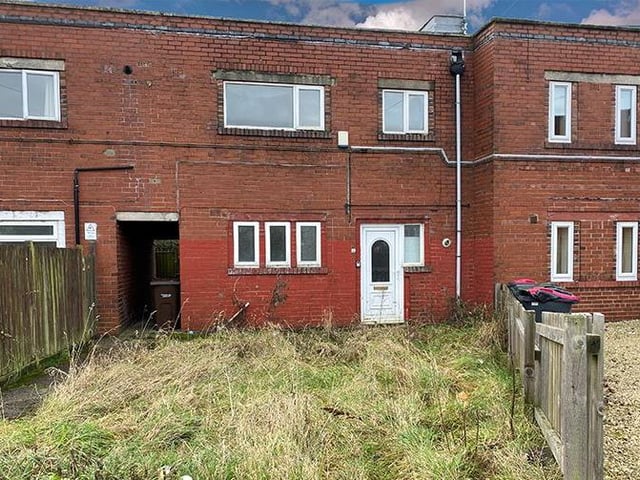 Three-bedroom, mid-terraced house - guide price £15,000-plus.