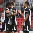 Newcastle's Callum Wilson celebrates his goal with Allan Saint-Maximin. Picture: Andrew Roe/AHPIX LTD.