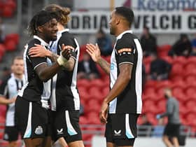 Newcastle's Callum Wilson celebrates his goal with Allan Saint-Maximin. Picture: Andrew Roe/AHPIX LTD.