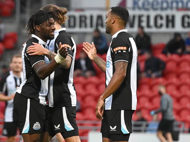Newcastle's Callum Wilson celebrates his goal with Allan Saint-Maximin. Picture: Andrew Roe/AHPIX LTD.