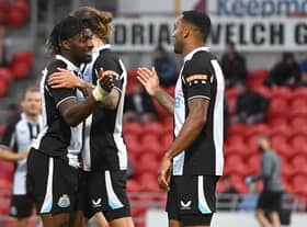 Newcastle's Callum Wilson celebrates his goal with Allan Saint-Maximin. Picture: Andrew Roe/AHPIX LTD.