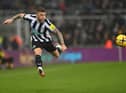 Newcastle player Kieran Trippier is airbourne as he puts over a cross during the Premier League match between Newcastle United and Leeds United at St. James Park on December 31, 2022 in Newcastle upon Tyne, England. (Photo by Stu Forster/Getty Images)