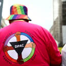 An activist wearing a t-shirt against disability benefit cuts during a protest over proposed cuts organised by the People's Assembly earlier this month in London. Photo by Alishia Abodunde/Getty Images