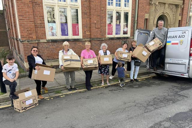 Volunteers from Starch help driver Kevin Roddam load the van ready to drive to Ukraine. Picture by FRANK REID