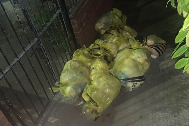 Bags of dirty nappies and PPE dumped outside of the nursery's gates.
