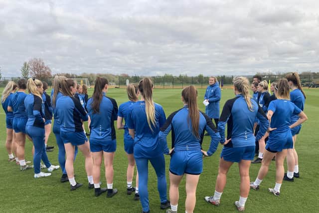 Newcastle United Women head coach Becky Langley speaks to her players at the first-team training ground.