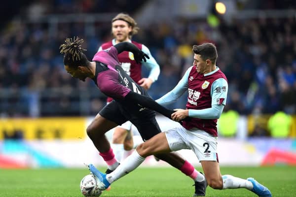 BURNLEY, ENGLAND - JANUARY 04: Ivan Toney of Peterborough United is challenged by Matthew Lowton of Burnley during the FA Cup Third Round match between Burnley FC and Peterborough United at Turf Moor on January 04, 2020 in Burnley, England. (Photo by Nathan Stirk/Getty Images)