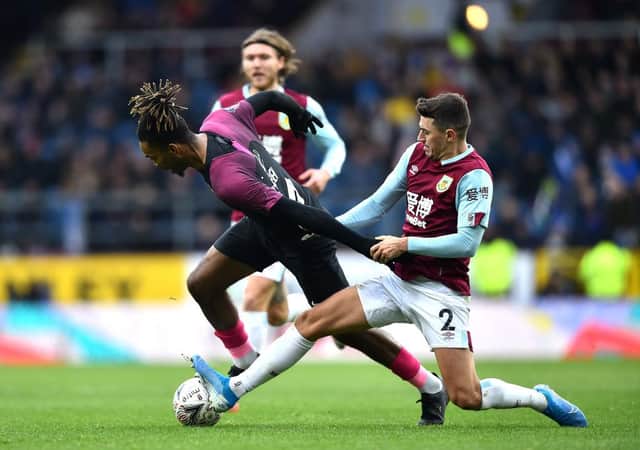 BURNLEY, ENGLAND - JANUARY 04: Ivan Toney of Peterborough United is challenged by Matthew Lowton of Burnley during the FA Cup Third Round match between Burnley FC and Peterborough United at Turf Moor on January 04, 2020 in Burnley, England. (Photo by Nathan Stirk/Getty Images)