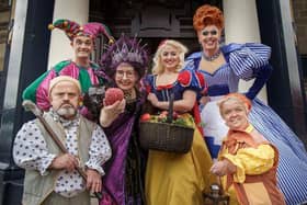 Su Pollard takes centre stage with the cast of Snow White and the Seven Dwarfs. Picture by David Wood.