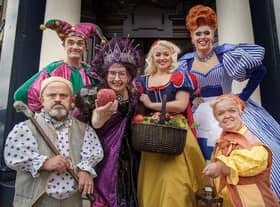 Su Pollard takes centre stage with the cast of Snow White and the Seven Dwarfs. Picture by David Wood.