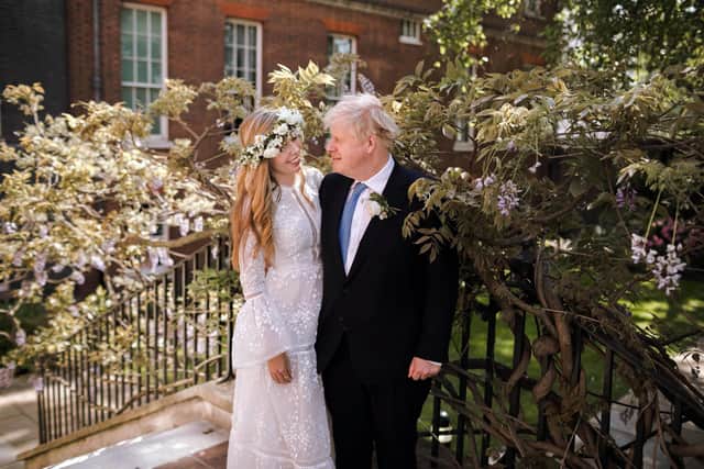 Downing Street photo of Prime Minister Boris Johnson and Carrie Johnson in the garden of 10 Downing Street after their wedding on Saturday. Picture: Rebecca Fulton/Downing Street/PA Wire.