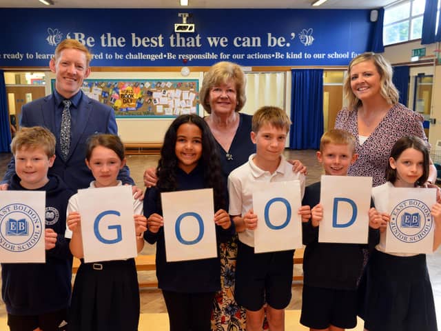 (left to right) Headteacher Tim Shenton, Chair of Governors Maureen Skevington and Deputy Headteacher Kaye Seebacher celebrate the school's good Ofsted report with some of the pupils.