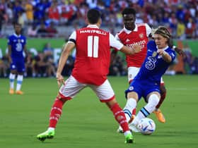 ORLANDO, FLORIDA - JULY 23: Connor Gallagher of Chelsea on the ball whilst under pressure from Bukayo Saka and Gabriel Martinelli of Arsenal during the Florida Cup match between Chelsea and Arsenal at Camping World Stadium on July 23, 2022 in Orlando, Florida. (Photo by Mike Ehrmann/Getty Images)