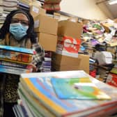 Book Aid For Africa founder Elewechi Okike preparing for the books to head out to Nigeria.