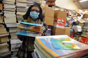 Book Aid For Africa founder Elewechi Okike preparing for the books to head out to Nigeria.