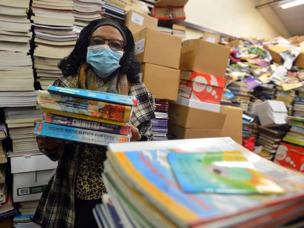 Book Aid For Africa founder Elewechi Okike preparing for the books to head out to Nigeria.