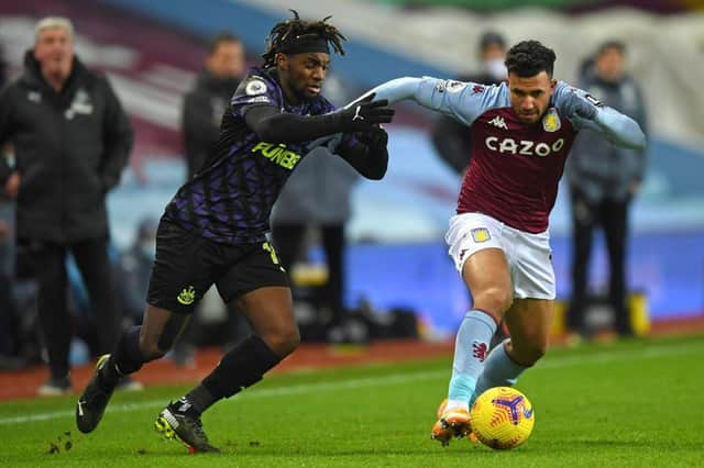 Allan Saint-Maximin vies with Trezeguet at Villa Park.