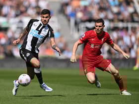 Bruno Guimaraes of Newcastle United is challenged by James Milner of Liverpool during the Premier League match between Newcastle United and Liverpool at St. James Park on April 30, 2022 in Newcastle upon Tyne, England. (Photo by Stu Forster/Getty Images)
