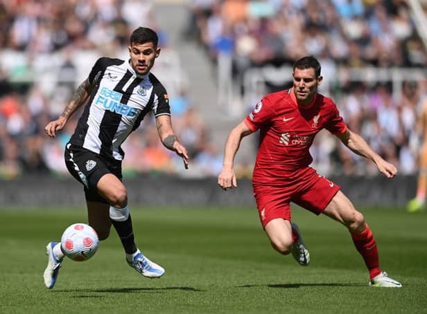 Bruno Guimaraes of Newcastle United is challenged by James Milner of Liverpool during the Premier League match between Newcastle United and Liverpool at St. James Park on April 30, 2022 in Newcastle upon Tyne, England. (Photo by Stu Forster/Getty Images)