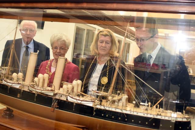 The Mayor and Mayoress Mrs Mary French join Councillor Alan Kerr and Geoff Woodward from Tyne and Wear Archives and Museums to celebrate the scale model of Royal Navy vessel, HMS Pique, being displayed at Hebburn Central.