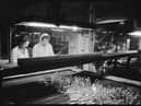 Women at work in the packing department of the Wear Flint Glass Works, Sunderland 1961. © Historic England Archive.