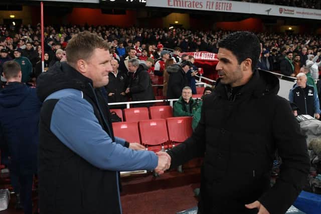 Arsenal manager Mikel Arteta shakes hands with Newcastle United head coach Eddie Howe.