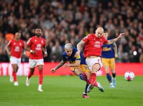 Bruno Guimaraes of Newcastle United is challenged by Jonjo Shelvey of Nottingham Forest during the Premier League match between Nottingham Forest and Newcastle United at City Ground on March 17, 2023 in Nottingham, England. (Photo by Shaun Botterill/Getty Images)