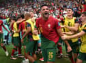 Goncalo Ramos of Portugal celebrates after scoring the team's first goal during the FIFA World Cup Qatar 2022 Round of 16 match between Portugal and Switzerland at Lusail Stadium on December 06, 2022 in Lusail City, Qatar. (Photo by Justin Setterfield/Getty Images)