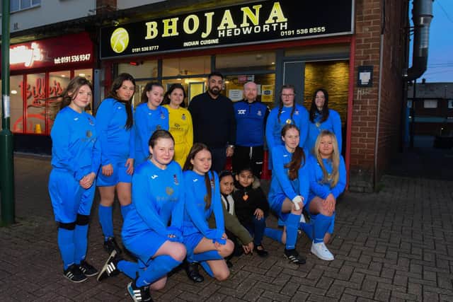 Mizamul Islam (5th left back row) with coach Anth Atkinson (6th from left, back row) and members of the Jarrow Vikings U13 Girls football team, now sponsored by Bhojana, of Fellgate Avenue, Jarrow.