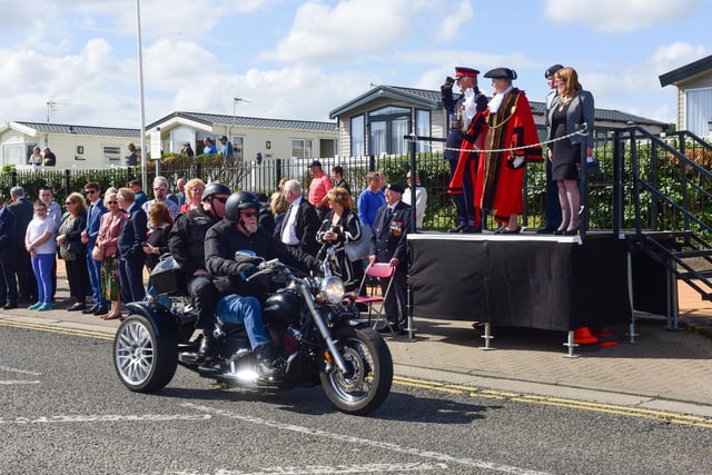 An estimated 500 motorbike and scooter riders rode past the podium for civic dignitaries.