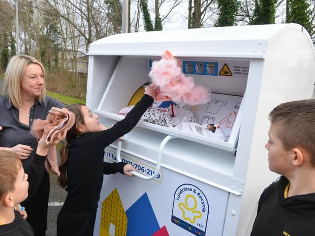 Fatfield Academy Inspires Deputy Headteacher Nicky Dowdle with members of the Eco Warrior team donating items at the new clothing recycling station.