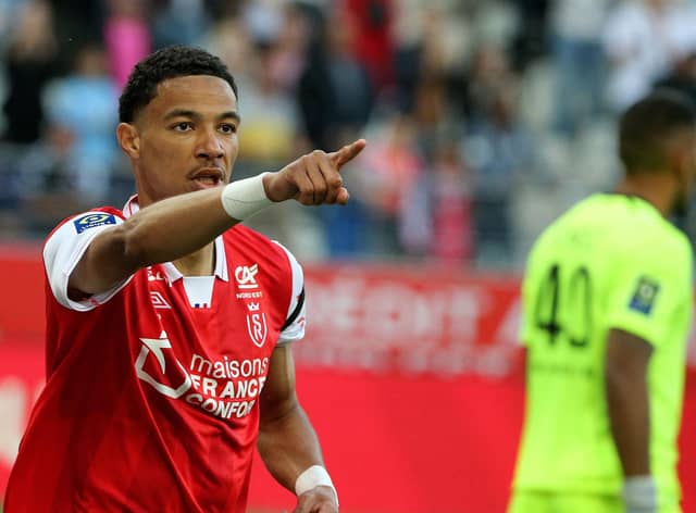 Reims' French forward Hugo Ekitike celebrates after scoring a goal during the French L1 football match between Stade de Reims and OGC Nice at Stade Auguste-Delaune in Reims, northern France on May 21, 2022. (Photo by FRANCOIS NASCIMBENI / AFP) (Photo by FRANCOIS NASCIMBENI/AFP via Getty Images)