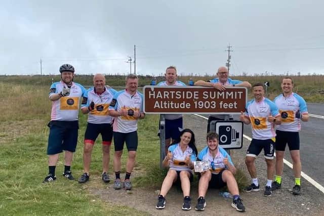 Zack Curry and the cycling team at Hartside Summit during their epic challenge.