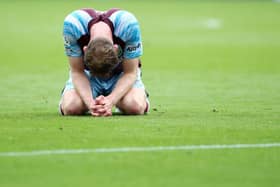 Nathan Collins of Burnley looks dejected following defeat and relegation to the Sky Bet Championship following the Premier League match between Burnley and Newcastle United at Turf Moor on May 22, 2022 in Burnley, England. (Photo by Jan Kruger/Getty Images)
