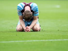 Nathan Collins of Burnley looks dejected following defeat and relegation to the Sky Bet Championship following the Premier League match between Burnley and Newcastle United at Turf Moor on May 22, 2022 in Burnley, England. (Photo by Jan Kruger/Getty Images)