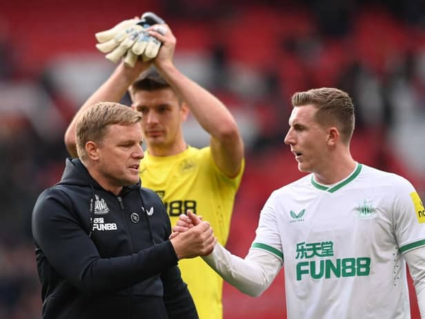 Eddie Howe, Manager of Newcastle United, shakes hands with Matt Targett of Newcastle United following the Premier League match between Manchester United and Newcastle United at Old Trafford on October 16, 2022 in Manchester, England. (Photo by Stu Forster/Getty Images)