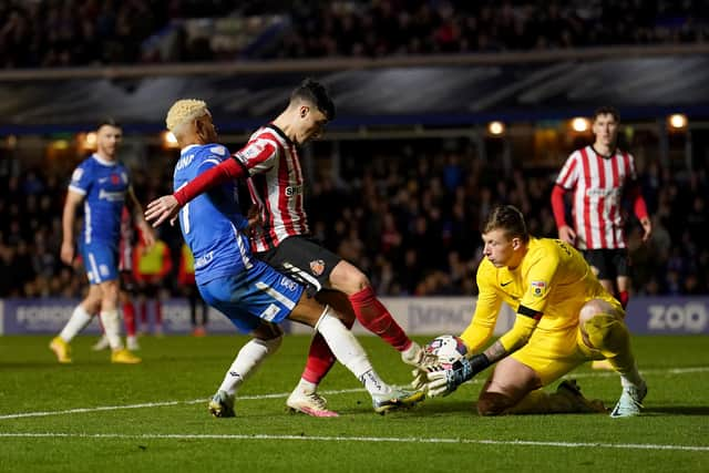 Sunderland’s Anthony Patterson (right) collects the ball as Sunderland’s Niall Huggins (centre) defends from Birmingham City’s Juninho Bacuna during the Sky Bet Championship match at St. Andrew's, Birmingham. Picture date: Friday November 11, 2022.