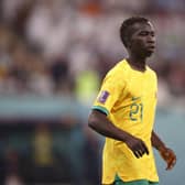 Garang Kuol of Australia looks on during the FIFA World Cup Qatar 2022 Round of 16 match between Argentina and Australia at Ahmad Bin Ali Stadium on December 03, 2022 in Doha, Qatar. (Photo by Robert Cianflone/Getty Images for Football Australia)